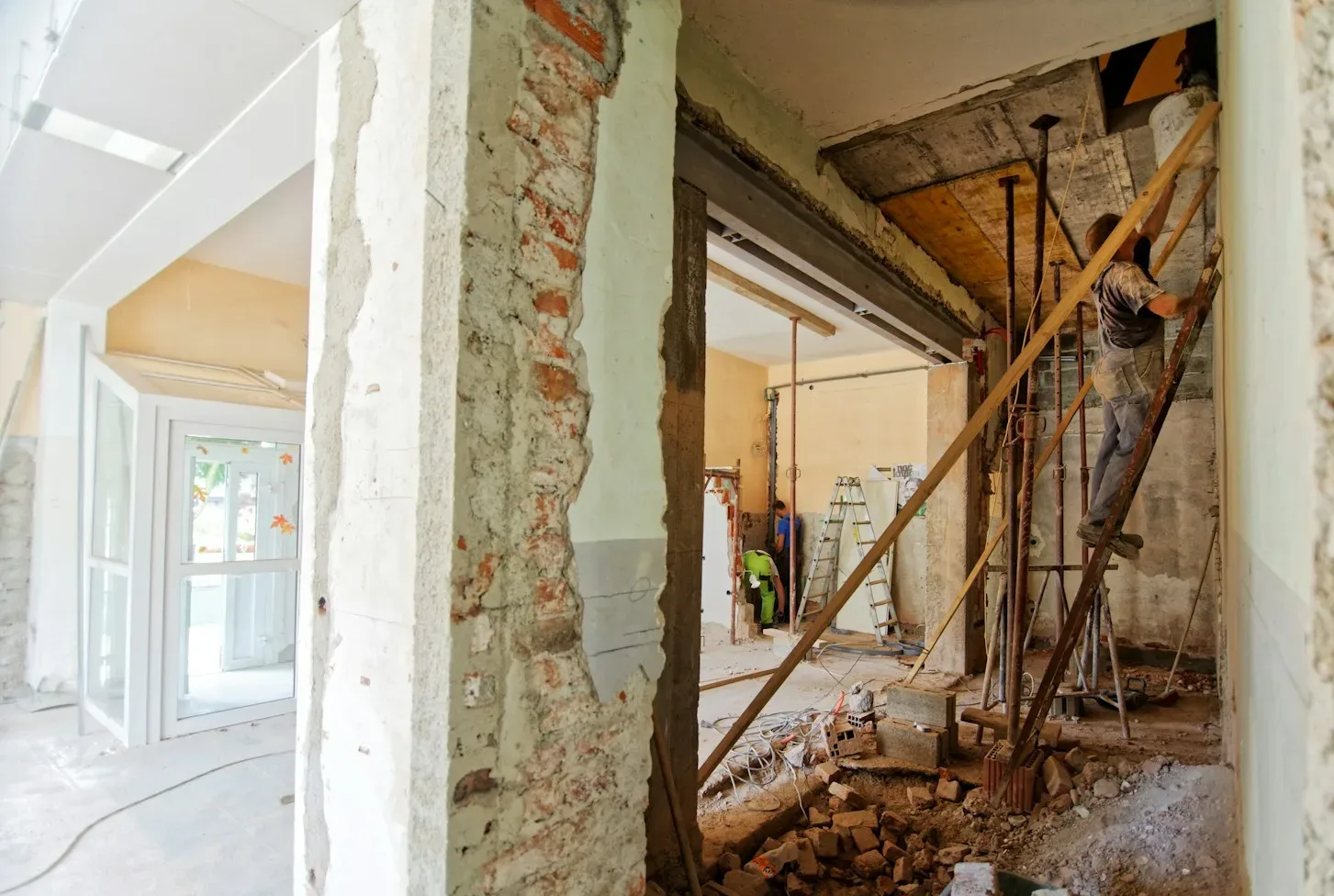 man climbing on ladder inside room